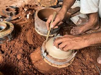 Sand casting a brass urn in the Moradabad foundry